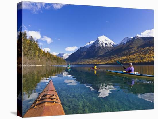 Sea Kayaking on Bowman Lake in Autumn in Glacier National Park, Montana, Usa-Chuck Haney-Stretched Canvas