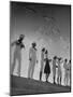 Seagulls Flying Above Group of Sailors and Waves-Alfred Eisenstaedt-Mounted Photographic Print