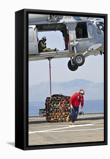 Seaman Hooks a Pallet to an Mh-60S Sea Hawk Helicopter-null-Framed Stretched Canvas