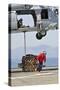 Seaman Hooks a Pallet to an Mh-60S Sea Hawk Helicopter-null-Stretched Canvas
