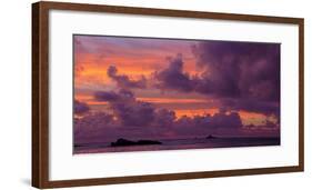 Seascape with rock formations silhouetted under moody sky at sunset, La Digue, Seychelles-Panoramic Images-Framed Photographic Print