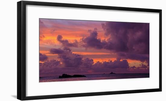 Seascape with rock formations silhouetted under moody sky at sunset, La Digue, Seychelles-Panoramic Images-Framed Photographic Print