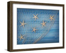 Seastars on the Fishing Net on a Blue Background-egal-Framed Photographic Print