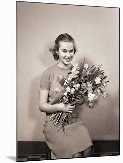 Seated Girl Holding Flowers-Philip Gendreau-Mounted Photographic Print