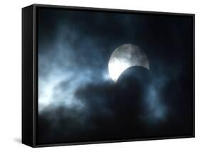 Seen Through Clouds the Sun is Partially Obscured by the Moon During an Eclipse-null-Framed Stretched Canvas