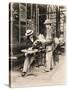 Seller of Statues on a Cafe Terrace, Paris, 1910-null-Stretched Canvas