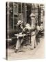 Seller of Statues on a Cafe Terrace, Paris, 1910-null-Stretched Canvas