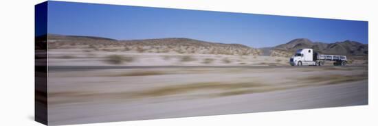 Semi-Truck on a Highway, Blurred Motion-null-Stretched Canvas