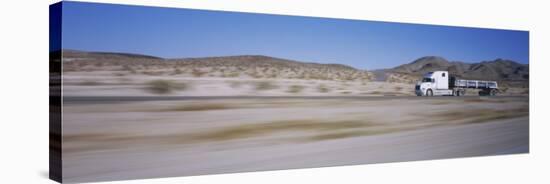 Semi-Truck on a Highway, Blurred Motion-null-Stretched Canvas