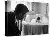 Sen. Jack Kennedy Admiring Baby Caroline as She Lies in Her Crib in Nursery at Georgetown Home-Ed Clark-Stretched Canvas