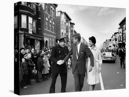 Sen. Jack Kennedy with Jackie, Walking Down Middle of the Street During Senate Re-Election Campaign-Carl Mydans-Stretched Canvas