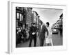 Sen. Jack Kennedy with Jackie, Walking Down Middle of the Street During Senate Re-Election Campaign-Carl Mydans-Framed Photographic Print