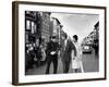 Sen. Jack Kennedy with Jackie, Walking Down Middle of the Street During Senate Re-Election Campaign-Carl Mydans-Framed Photographic Print