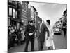 Sen. Jack Kennedy with Jackie, Walking Down Middle of the Street During Senate Re-Election Campaign-Carl Mydans-Mounted Photographic Print