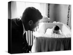 Sen. John F. Kennedy Playing Peek-A-Boo with His Daughter Caroline in Her Crib-Ed Clark-Stretched Canvas