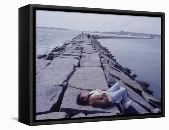 Senator Edward M. Kennedy Basking in Sun on Breakwater in Hyannis Port-John Loengard-Framed Stretched Canvas