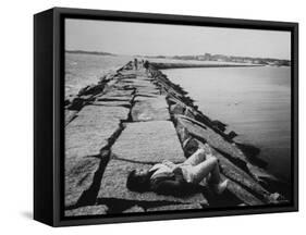 Senator Edward M. Kennedy Taking a Sunbath on Breakwater Near His Summer Home-John Loengard-Framed Stretched Canvas