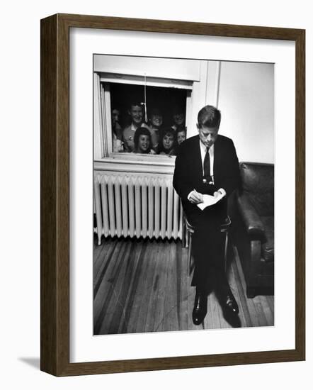 Senator John F. Kennedy Checking over Speech During His Presidential Campaign-Paul Schutzer-Framed Photographic Print