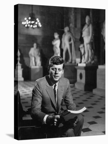 Senator John F. Kennedy Seated in Museum with Statues-Hank Walker-Stretched Canvas