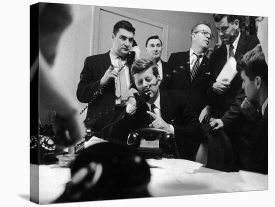 Senator John F. Kennedy Talking on the Phone Surrounded by Aides During the Primary Elections-Stan Wayman-Stretched Canvas