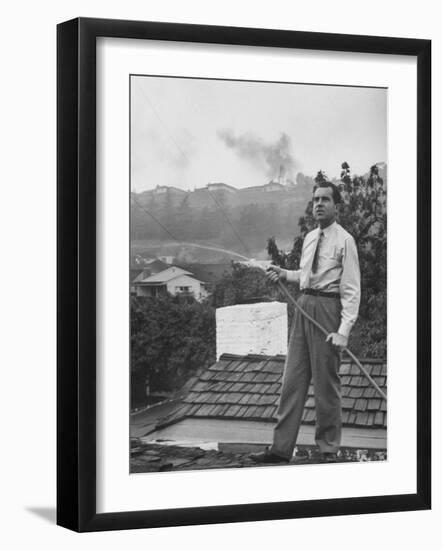 Senator Richard M. Nixon on Roof of Home in Los Angeles, Putting Out Fires Caused by Brush Blaze-Allan Grant-Framed Photographic Print