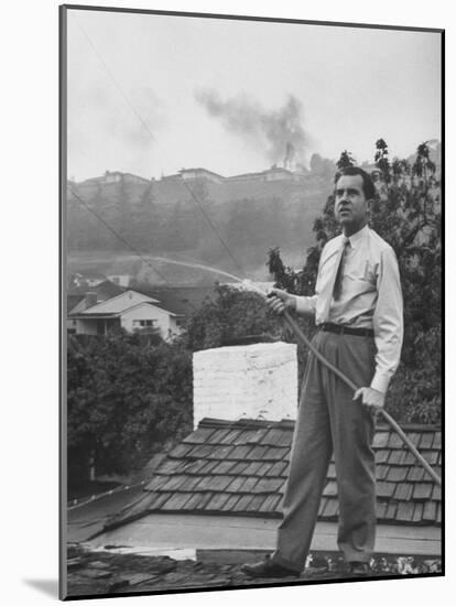 Senator Richard M. Nixon on Roof of Home in Los Angeles, Putting Out Fires Caused by Brush Blaze-Allan Grant-Mounted Photographic Print