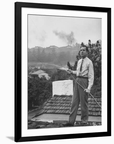 Senator Richard M. Nixon on Roof of Home in Los Angeles, Putting Out Fires Caused by Brush Blaze-Allan Grant-Framed Photographic Print