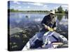 Senior Man Holding a Fish-null-Stretched Canvas