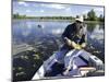 Senior Man Holding a Fish-null-Mounted Photographic Print