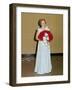 Senior Woman with Bouquet Poses Against Wall, Ca. 1970-null-Framed Photographic Print