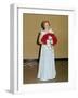 Senior Woman with Bouquet Poses Against Wall, Ca. 1970-null-Framed Photographic Print