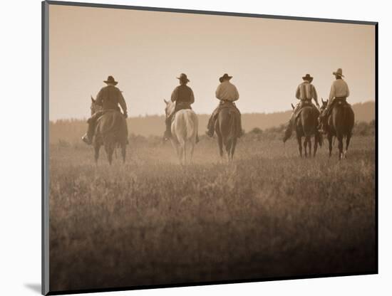 Sepia Effect of Cowboys Riding, Seneca, Oregon, USA-Nancy & Steve Ross-Mounted Photographic Print