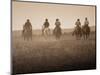 Sepia Effect of Cowboys Riding, Seneca, Oregon, USA-Nancy & Steve Ross-Mounted Photographic Print