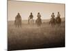 Sepia Effect of Cowboys Riding, Seneca, Oregon, USA-Nancy & Steve Ross-Mounted Photographic Print