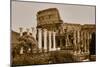 Sepia image of columns of the Forum and Colosseum or Roman Coliseum at dusk with streaked car li...-null-Mounted Photographic Print