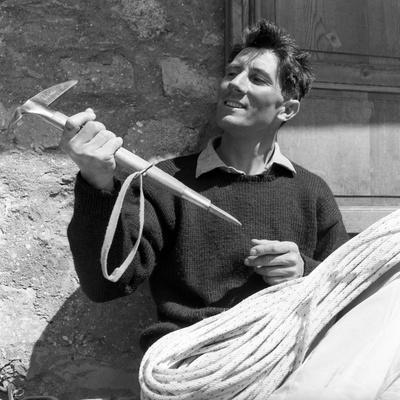 Portrait of Walter Bonatti Smiling with a Climbing Pickaxe in His Hands