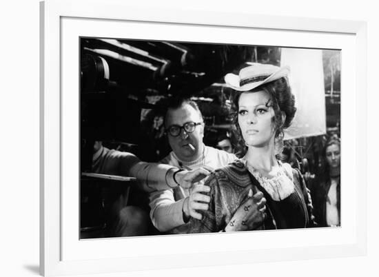 Sergio Leone (1929 - 1989) and Claudia Cardinale during the shooting of Once Upon a Time in the Wes-null-Framed Photo