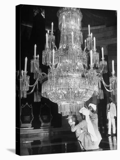 Servants of British Lord Archibald Wavell cleaning Crystal Chandelier in Opulent Palace-Margaret Bourke-White-Stretched Canvas