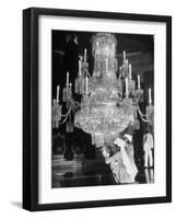 Servants of British Lord Archibald Wavell cleaning Crystal Chandelier in Opulent Palace-Margaret Bourke-White-Framed Photographic Print