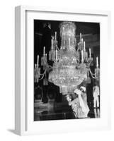 Servants of British Lord Archibald Wavell cleaning Crystal Chandelier in Opulent Palace-Margaret Bourke-White-Framed Photographic Print