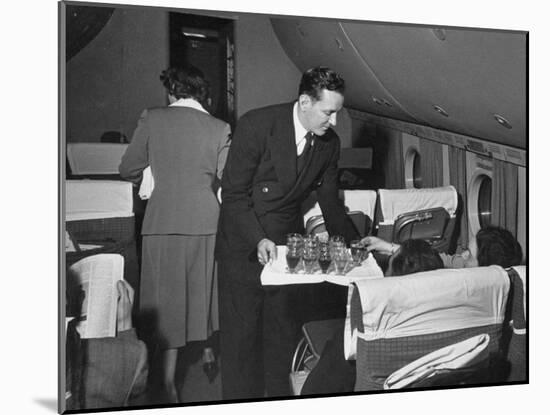 Serving Drinks, over English Channel, before Dinner, During a Transatlantic Flight-Peter Stackpole-Mounted Photographic Print