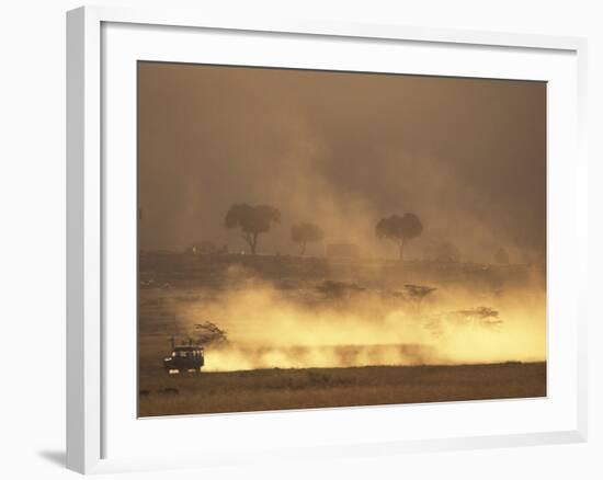 Setting Sun Lights Cloud of Dust, Masai Mara Game Reserve, Kenya-Paul Souders-Framed Photographic Print