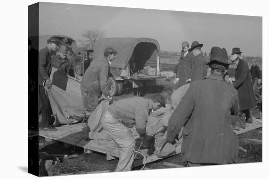 Setting up a tent in the camp for white flood refugees at Forrest City, Arkansas, 1937-Walker Evans-Stretched Canvas