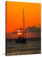 Seven Mile Beach, Grand Cayman. Sailboat on the Carribean at sunset.-Jolly Sienda-Stretched Canvas