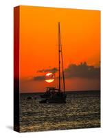 Seven Mile Beach, Grand Cayman. Sailboat on the Carribean at sunset.-Jolly Sienda-Stretched Canvas