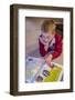 Seven year old boy reading his world atlas book. (MR)-Janet Horton-Framed Photographic Print