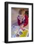 Seven year old boy reading his world atlas book. (MR)-Janet Horton-Framed Photographic Print