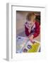 Seven year old boy reading his world atlas book. (MR)-Janet Horton-Framed Photographic Print