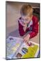 Seven year old boy reading his world atlas book. (MR)-Janet Horton-Mounted Photographic Print