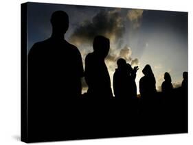 Several Africans Immigrants Chat at Sunset Outside of the Holding Centre for Immigrants-null-Stretched Canvas